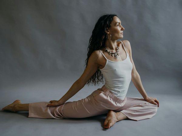 Serene woman enjoying her flexibility and inner peace